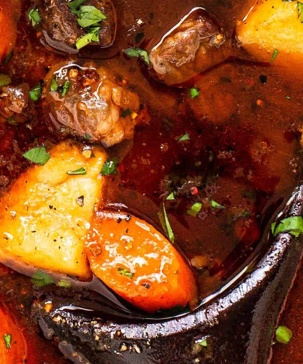 Black Shroud Stew A rich, hearty broth simmered with root vegetables, tender cuts of meat, and a sprinkle of sparkly herbs.