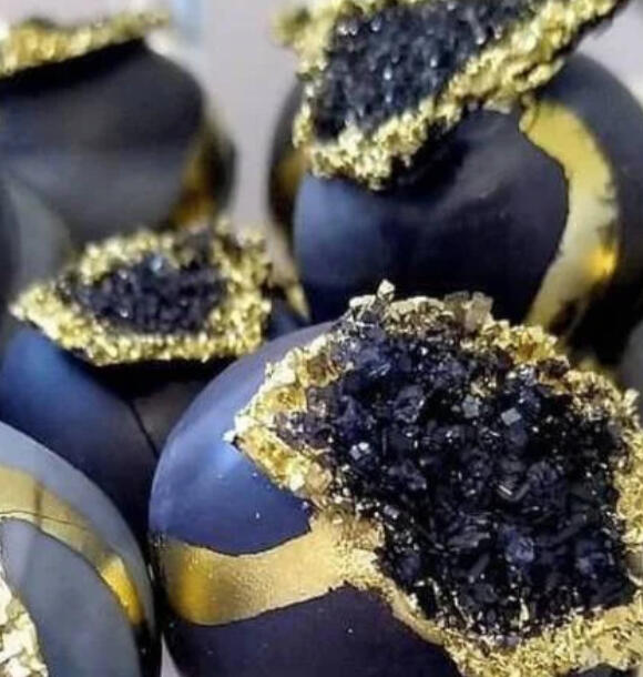 Kupo Dust Truffles Bite-sized chocolates dusted with glittering golden sugar and purple rock candy, filled with raspberry and dark cocoa.