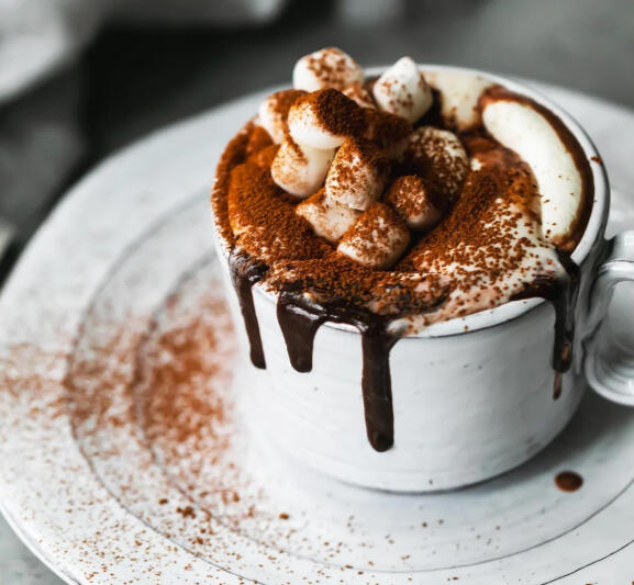 Moghome Cocoa Piping hot dark chocolate and creme topped with mini marshmallows, syrup and cocoa powder.