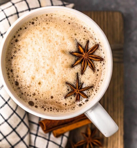 Mog-Spice tea A spiced black tea with cinnamon, cardamom, and clove with frothed milk. Topped with star anise.